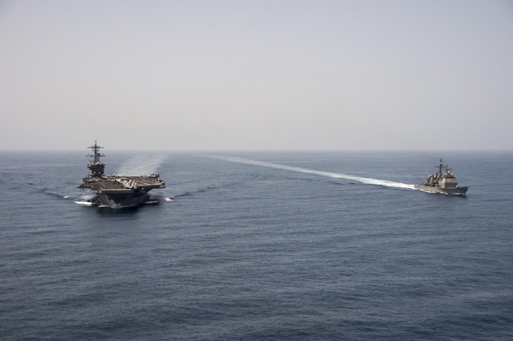 150421-N-ZF498-155 ARABIAN SEA (April 21, 2015) The aircraft carrier USS Theodore Roosevelt (CVN 71) and the guided-missile cruiser USS Normandy (CG 60) operate in the Arabian Sea conducting maritime security operations. (U.S. Navy photo by Mass Communication Specialist 3rd Class Anthony N. Hilkowski/Released)